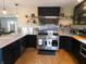Contemporary kitchen features stainless steel appliances, a large range, and ample counter space at 4815 Carrollton Ave, Indianapolis, IN 46205