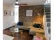 Cozy living room showcases a decorative brick wall, modern sofa, and a glass coffee table at 4815 Carrollton Ave, Indianapolis, IN 46205