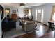 Cozy living room featuring hardwood floors, natural lighting, and a comfortable seating arrangement at 4815 Carrollton Ave, Indianapolis, IN 46205