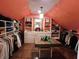 Bright walk-in closet with custom shelving, a central table, and a unique design at 4815 Carrollton Ave, Indianapolis, IN 46205