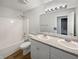 Bathroom featuring a double sink vanity, bathtub, shower, and neutral color palette at 491 Westview Dr, Bargersville, IN 46106