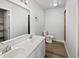 The clean bathroom features double sinks, a vanity with storage, and a bright, well-lit mirror at 491 Westview Dr, Bargersville, IN 46106