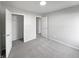 Bedroom with gray carpet and trim, and closet with shelving, ready for personal touches at 491 Westview Dr, Bargersville, IN 46106