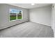 Cozy bedroom offers neutral carpet, ample natural light, and a serene atmosphere at 491 Westview Dr, Bargersville, IN 46106