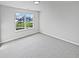 Bright bedroom with neutral carpet and walls and a view of the neighborhood at 491 Westview Dr, Bargersville, IN 46106
