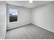 Bright bedroom with neutral carpet and walls, and a view of the backyard at 491 Westview Dr, Bargersville, IN 46106