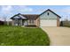 Charming single-Gathering home features a well-maintained lawn, attached garage, and inviting front entrance at 491 Westview Dr, Bargersville, IN 46106