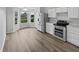 Bright kitchen featuring stainless steel appliances, white cabinets, and a sunny dining nook at 491 Westview Dr, Bargersville, IN 46106