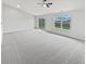 Bright, airy living room featuring neutral paint, soft carpet, and large windows for natural light at 491 Westview Dr, Bargersville, IN 46106