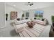 Spacious living room filled with sofas, a bookshelf, windows, and a modern rug at 491 Westview Dr, Bargersville, IN 46106