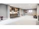 Finished basement with a convenient kitchenette, playroom, and ample natural light at 496 Bridgemont Ln, Carmel, IN 46032