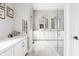 Large bathroom boasting double sinks, ample counter space, and a frameless glass shower at 496 Bridgemont Ln, Carmel, IN 46032