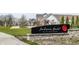 Community sign reading Jackson's Grant on Williams Creek, landscaped lawn and sidewalks at 496 Bridgemont Ln, Carmel, IN 46032