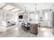 Open floor plan featuring a kitchen with an island and stainless steel appliances at 496 Bridgemont Ln, Carmel, IN 46032