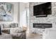 Inviting living room with stone fireplace, comfortable seating, and stylish decor at 496 Bridgemont Ln, Carmel, IN 46032