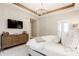 Spacious main bedroom with wood dresser and a modern ceiling fan at 496 Bridgemont Ln, Carmel, IN 46032