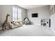 Charming playroom filled with natural light, kid-sized furniture, and playful decorations creating a fun space at 496 Bridgemont Ln, Carmel, IN 46032