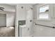 Bathroom featuring a white vanity, shower and fixtures and a window for natural light at 508 Miller Ave, Shelbyville, IN 46176