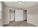 A cozy bedroom with a neutral color scheme, featuring a closet with sliding doors and plush carpeting at 508 Miller Ave, Shelbyville, IN 46176