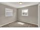 A bright bedroom with two windows, offering ample natural light and a view of the outdoors at 508 Miller Ave, Shelbyville, IN 46176