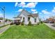 Well-maintained house with lush green lawn, mature landscaping, and sidewalk access at 508 Miller Ave, Shelbyville, IN 46176