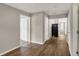 Hallway with wood floors, neutral walls, and doorways to other rooms at 508 Miller Ave, Shelbyville, IN 46176