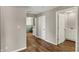 Hallway with wood floors and doorways to other rooms at 508 Miller Ave, Shelbyville, IN 46176