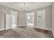 A carpeted living room with doorways to other rooms at 508 Miller Ave, Shelbyville, IN 46176