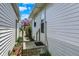 A view of the side yard shows a concrete walkway leading to the house at 508 Miller Ave, Shelbyville, IN 46176