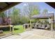 Charming backyard deck with covered outdoor dining area and stylish patio furniture at 5236 Skipping Stone Dr, Indianapolis, IN 46237
