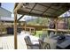 Charming backyard deck with covered outdoor dining area and stylish patio furniture at 5236 Skipping Stone Dr, Indianapolis, IN 46237