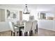 Bright dining room with a modern chandelier, stylish wall decor, and comfortable seating at 5236 Skipping Stone Dr, Indianapolis, IN 46237