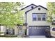 Inviting two-story home with a well-maintained lawn, covered porch, and an attached two-car garage at 5236 Skipping Stone Dr, Indianapolis, IN 46237