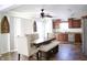 Bright kitchen and dining area with stainless steel appliances, wood cabinets, and large table with chairs at 5236 Skipping Stone Dr, Indianapolis, IN 46237