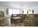 Spacious living room with a large sectional sofa, fireplace, and open layout for entertaining and relaxation at 5236 Skipping Stone Dr, Indianapolis, IN 46237