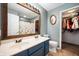 Bathroom features a double sink vanity, and a large mirror at 5500 W Sudbury Dr, Muncie, IN 47304