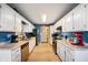 Modern kitchen with white cabinetry, granite countertops, stainless steel appliances, and ample storage space at 5500 W Sudbury Dr, Muncie, IN 47304