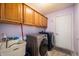 Laundry room with lots of storage and updated appliances at 5500 W Sudbury Dr, Muncie, IN 47304