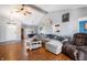 Inviting living room with hardwood floors, a comfortable sectional sofa, and a welcoming atmosphere for relaxation at 5500 W Sudbury Dr, Muncie, IN 47304