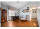 Bright office space featuring hardwood floors, a vintage desk, and a cozy armchair, perfect for a home workspace at 5500 W Sudbury Dr, Muncie, IN 47304