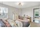 This well-lit bedroom offers a cozy retreat with a large window and a charming view at 5595 Auburndale Dr, Bargersville, IN 46106