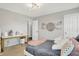 Bright bedroom features neutral walls, modern lighting, decorative shelving and a comfortable bed with plush pillows at 5595 Auburndale Dr, Bargersville, IN 46106