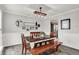 Stylish dining room with a rustic table, bench seating, and modern decor at 5595 Auburndale Dr, Bargersville, IN 46106