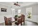 Elegant dining room with a farmhouse table, stylish light fixture, and plenty of natural light at 5595 Auburndale Dr, Bargersville, IN 46106