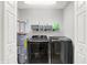 Practical laundry room features modern appliances, shelving, and is adjacent to water heater at 5595 Auburndale Dr, Bargersville, IN 46106