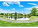 Scenic community pond with a walking path, lush greenery, and reflections of the surrounding homes at 5595 Auburndale Dr, Bargersville, IN 46106