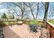 Spacious wooden deck with outdoor seating, perfect for entertaining and enjoying the scenic backyard views at 5927 Pine Hill Dr, Indianapolis, IN 46235