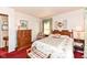 Cozy bedroom featuring vintage-style furnishings and soft floral accents, offering a comfortable retreat at 5927 Pine Hill Dr, Indianapolis, IN 46235