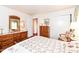Bright bedroom featuring a classic dresser and a closet, providing ample storage and comfort at 5927 Pine Hill Dr, Indianapolis, IN 46235
