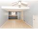 Open basement with light gray walls, white ceiling, tiled floor, and a kitchenette area at 6017 E 52Nd Pl, Indianapolis, IN 46226
